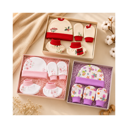 Set of baby booties, hats, and mittens in decorative boxes on a soft beige background.
